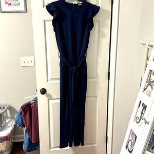 Navy blue ruffle sleeve jumper pant suit! With belt. Worn once size large.